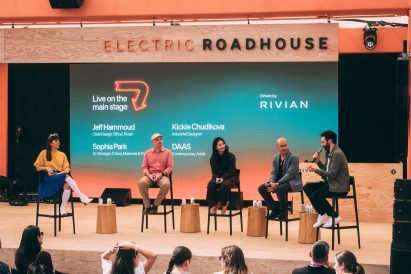 Photo of speakers on stage at a panel discussion at Rivian's Electric Roadhouse at SXSW 2025