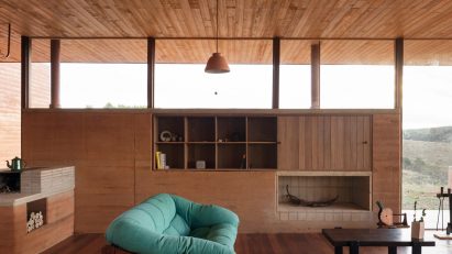 Living room with a rammed-earth wall