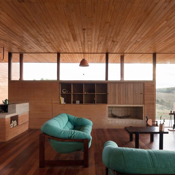 Living room with a rammed-earth wall