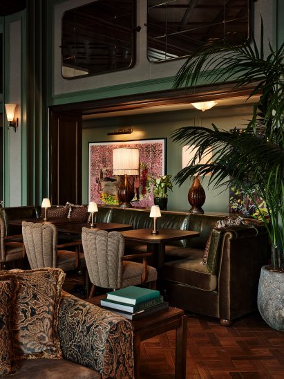 Dining area with an eclectic mix of furniture and artwork