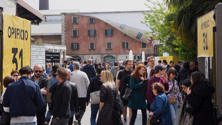 A photograph of a group of people in a street.
