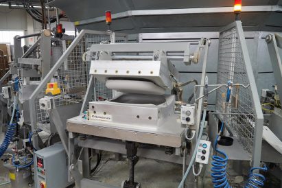 Photo of a machine moulding foam seat cushions in the Vitra factory