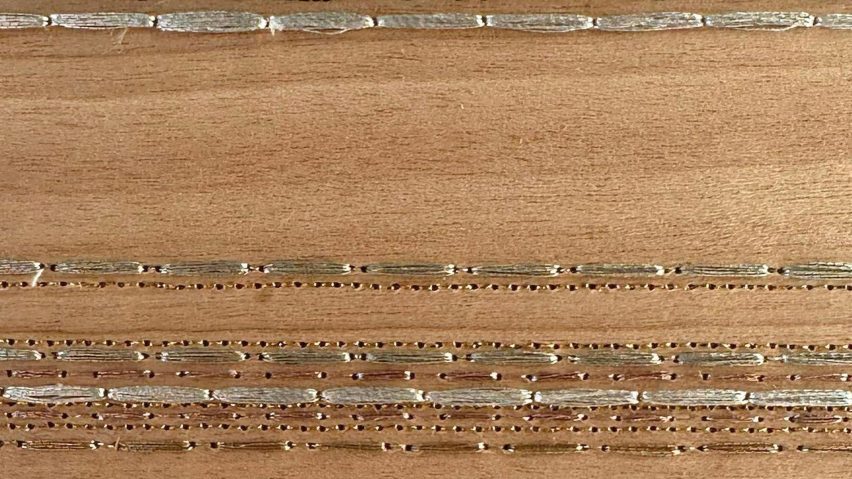 wood block with metal thread design