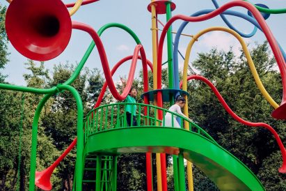 Children using the slide of the Otonomori sculpture by Yuri Suzuki in Shanghai's Jing’an Sculpture Park