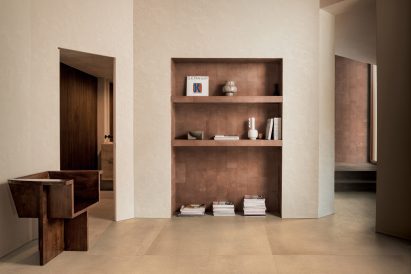 Photo of room with a shelving unit with tiles by Florim