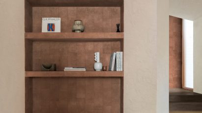 Photo of room with a shelving unit with tiles by Florim
