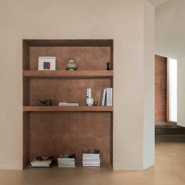 Photo of room with a shelving unit with tiles by Florim