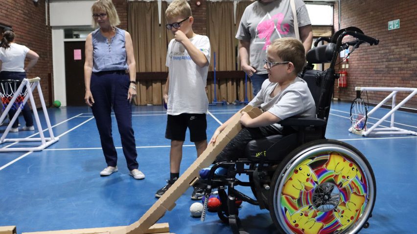 Photo of child in wheelchair playing sports