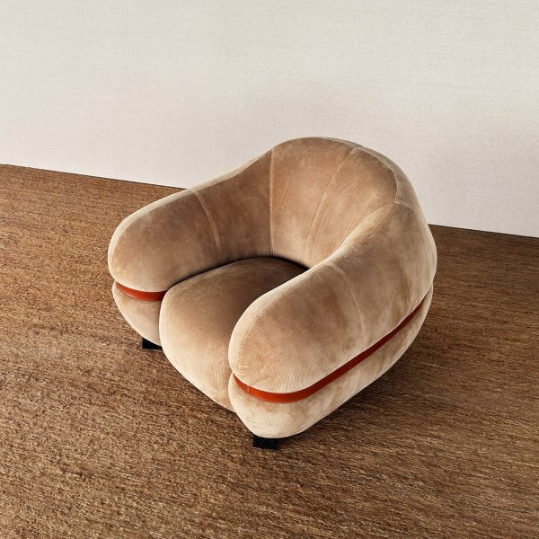 Photo of brown fabric arm chair