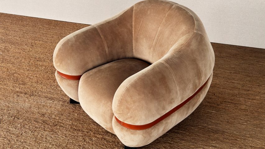 Photo of brown fabric arm chair