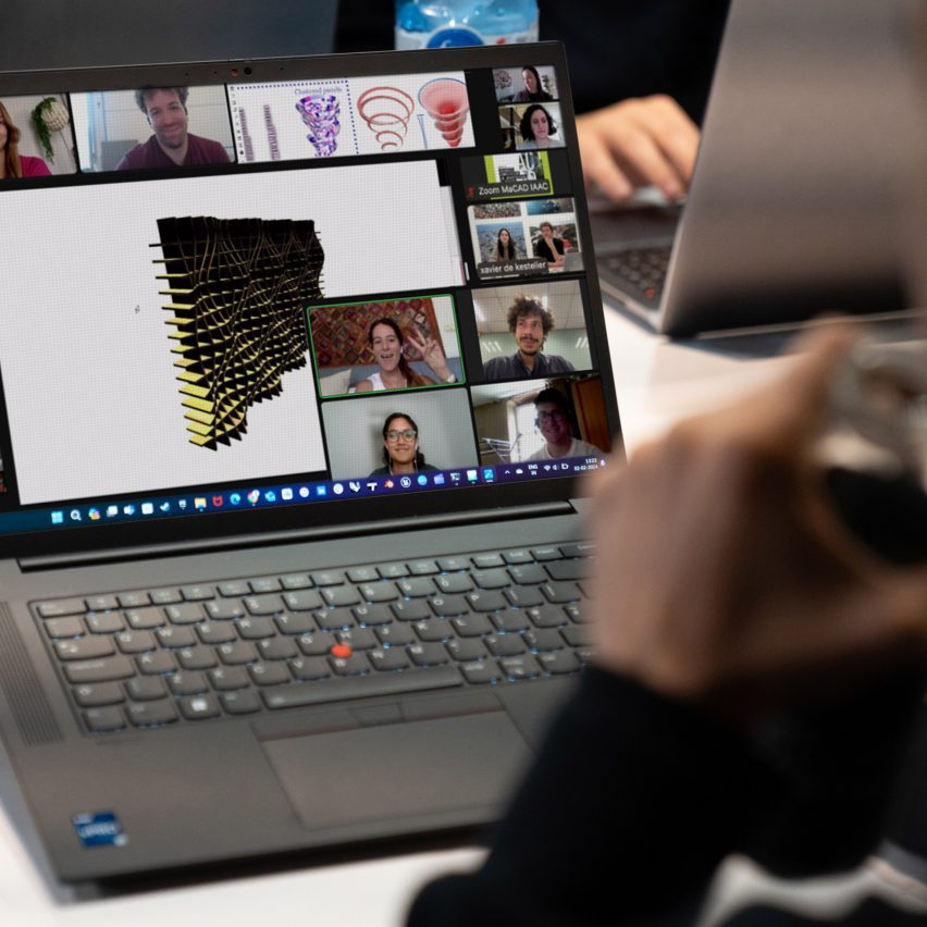 a photograph of a laptop with a digital design on it