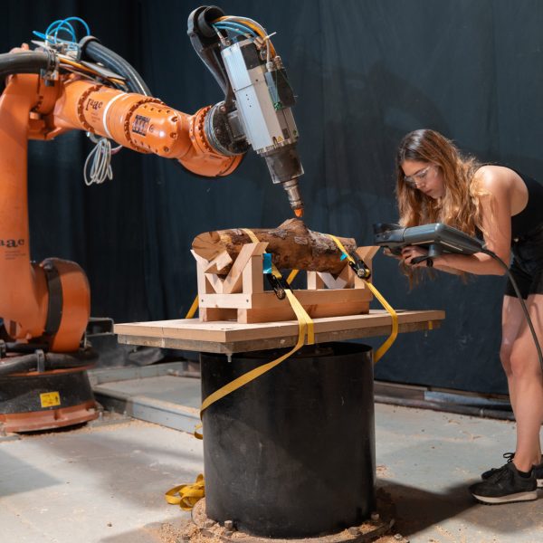 a photograph of a student using a robotics machine