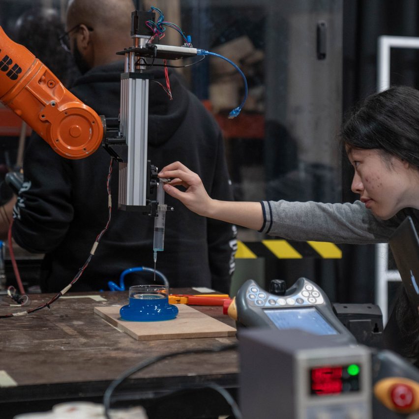 a photograph of a student using a engineering equipment