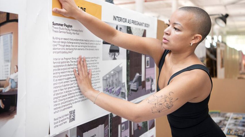 Photo of person putting up a poster