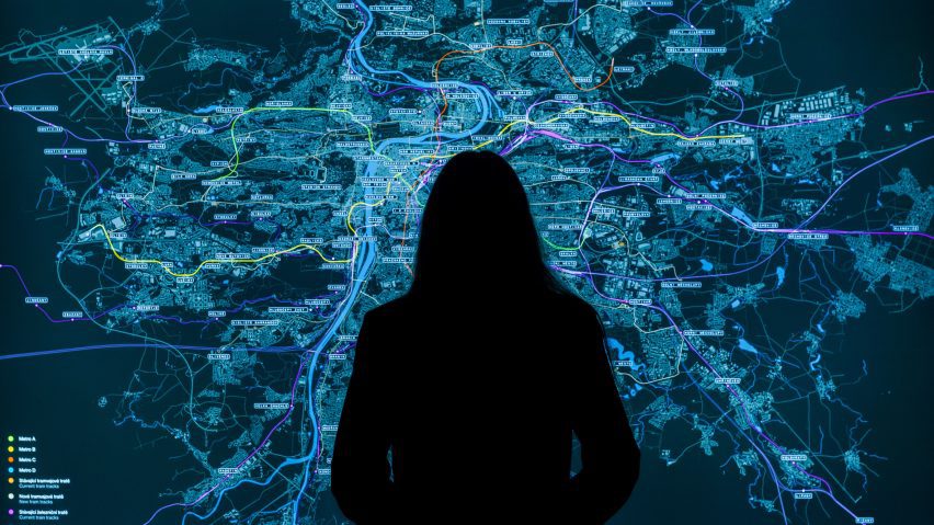 Photo of person stood in front of a map at the Prague Tomorrow? Connected City exhibition