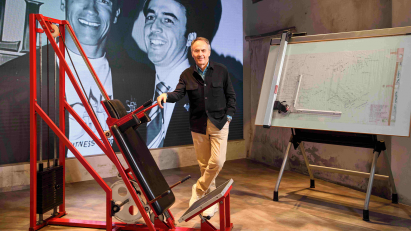 Technogym founder Nerio Alessandri standing next to gym equipment