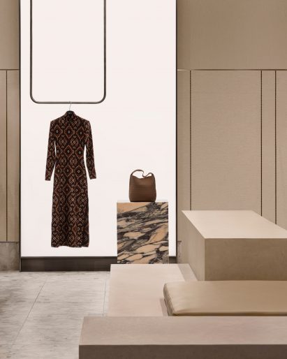 A dress and a bag in front of a large light panel