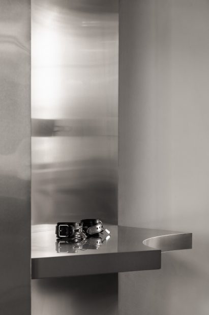 Handcuffs displayed on a metal shelf