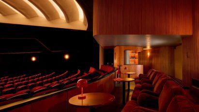 Swedish cinema revival with wooden curved bar