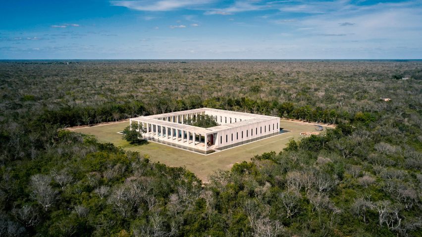 A square shaped building in the middle of the jungle