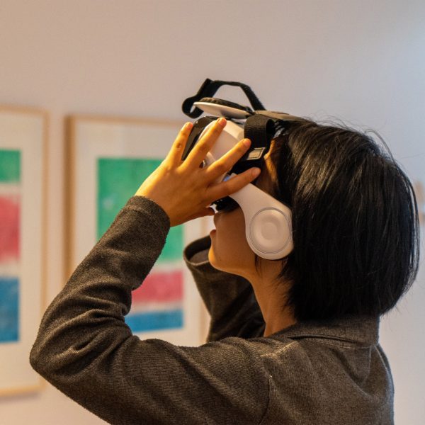 a photograph of a person wearing a VR headset