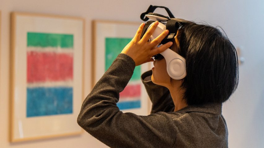 a photograph of a person wearing a VR headset