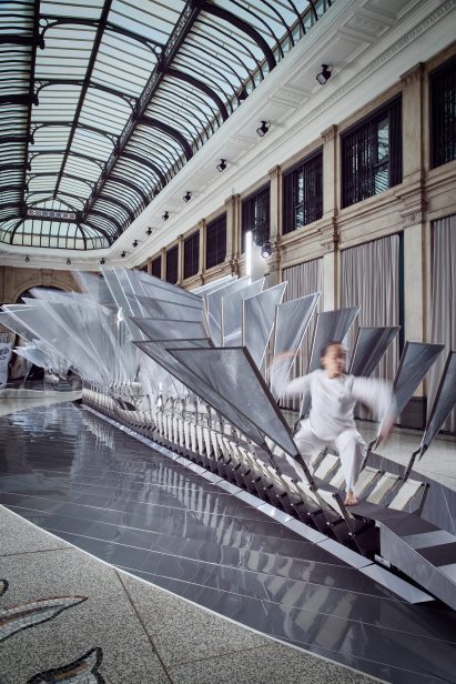 Dancers performing within the structure, which moves according to their actions