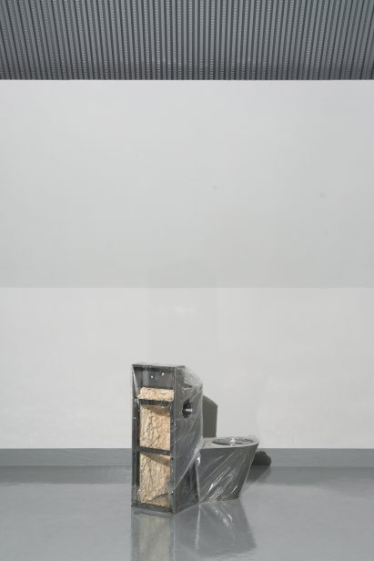 Rear view of prison toilet with sound insulation inside