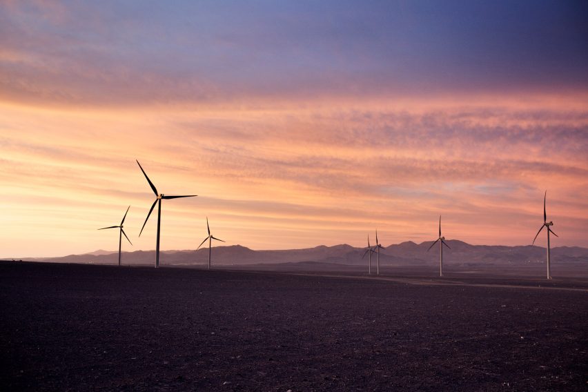 Wind power plant at sunset