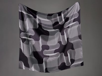 A black scarf with white, linear motif