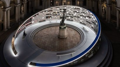 Visitor at Library of Light installation in Milan