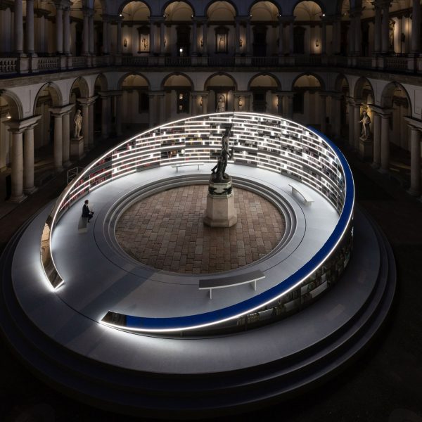 Visitor at Library of Light installation in Milan