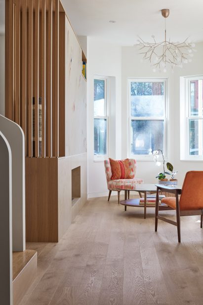 A wooden storage partition dividing a home's entry from the living area