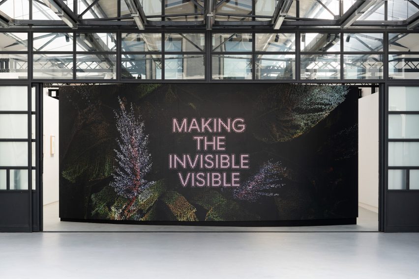 Photo to the entry of an exhibition reading 'Making the Invisible Visible'