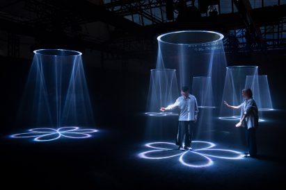 People playing with laser curtains