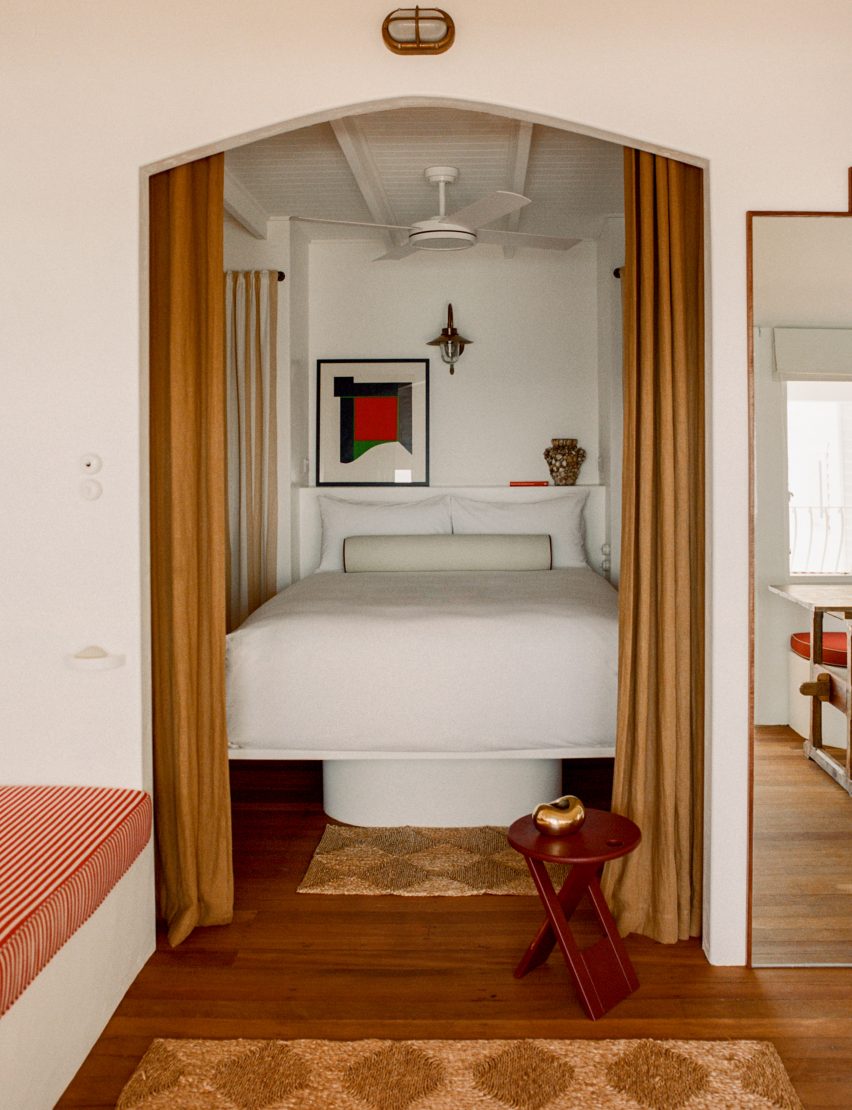 Bedroom alcove framed by curtains
