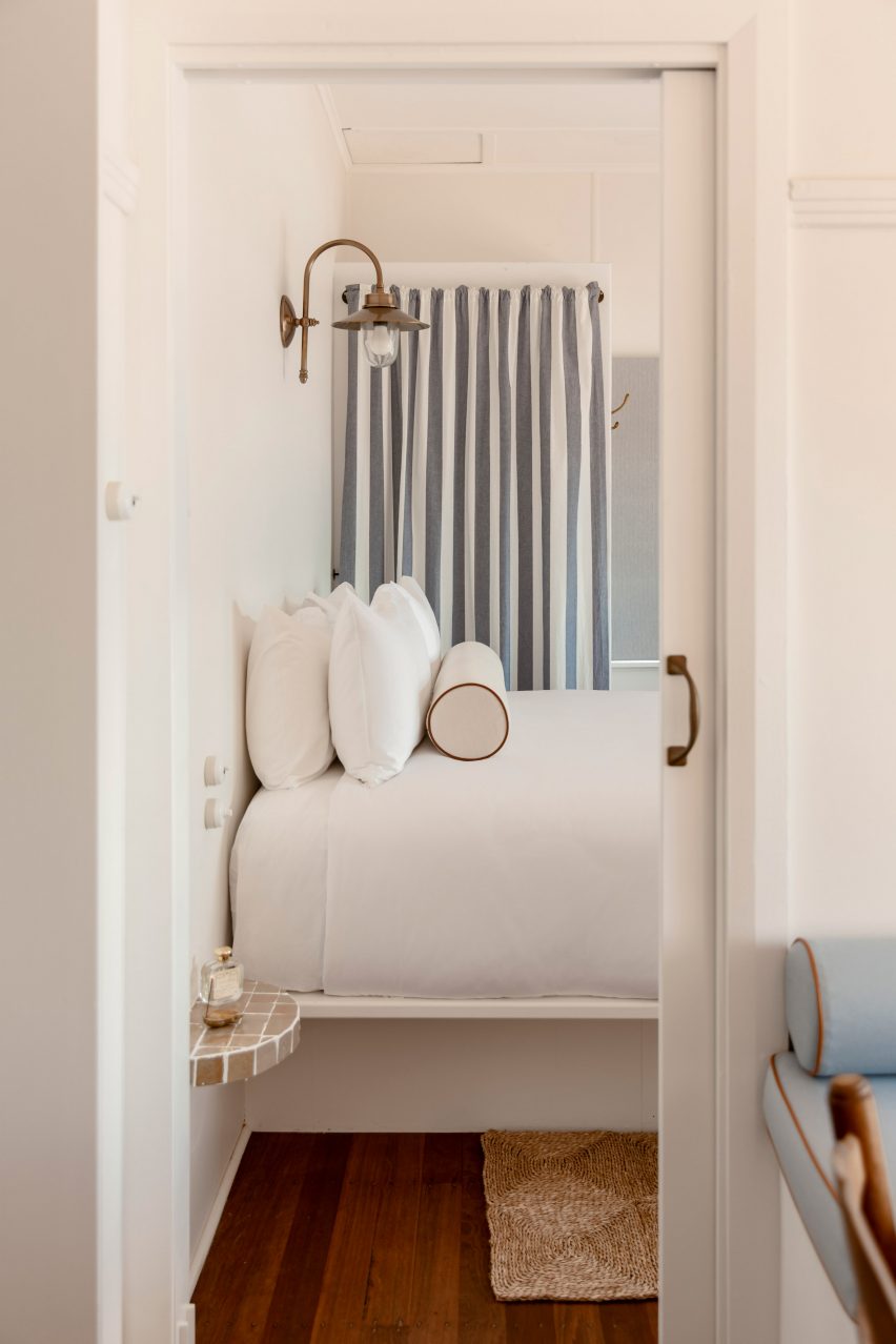 Pale blue-striped curtains in bedroom