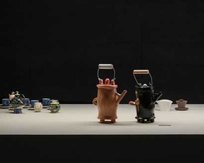 Teapots with happy faces