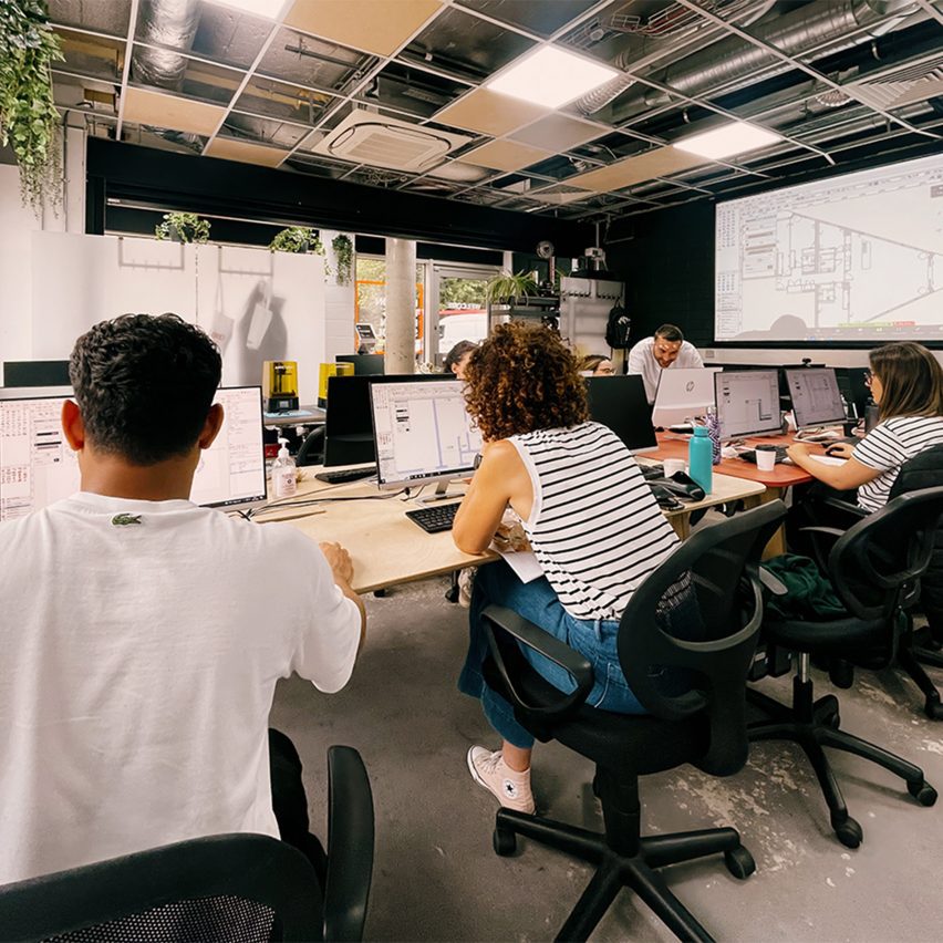 a photograph of students on computers in a classroom
