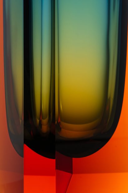 Close-up of facets in blue and orange vase