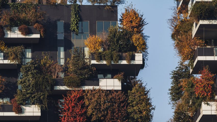 a photograph of an apartment building with plants in tones of brown and green on it