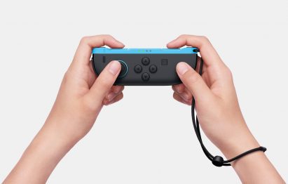 Image of a person's hands holding a Nintendo Switch 2 Joy-Con controller in horizontal mode