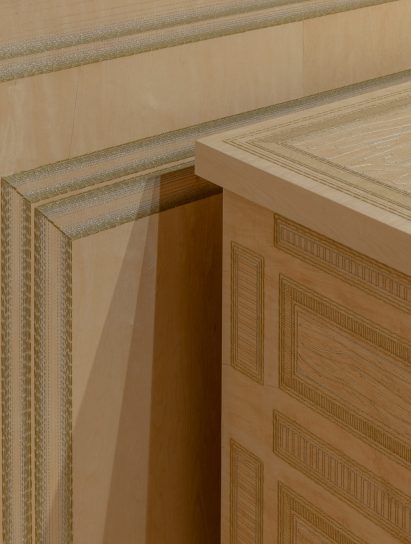 Wooden cabinet and wall panel embroidered with metal thread