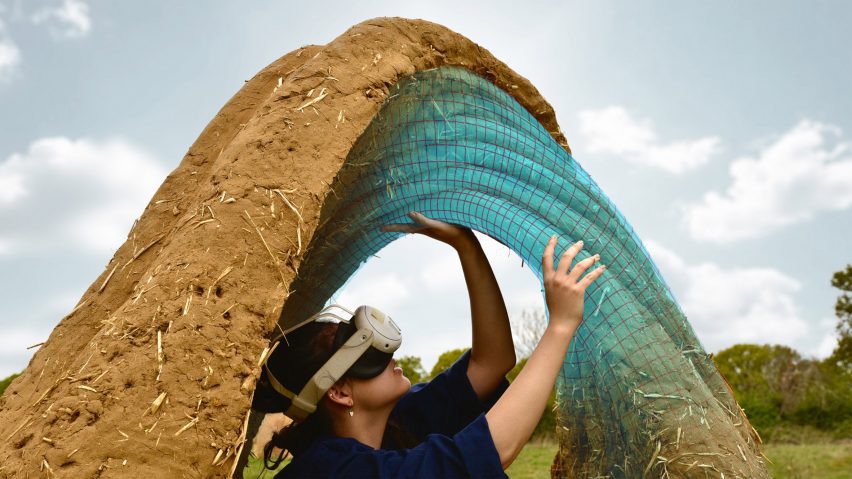 a photograph of a person wearing a VR headset underneath a brown circular structure