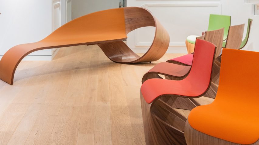 French designer Pierre Renart has created an American walnut and leather bench and a set of chairs for luxury brand Longchamp at Milan design week.