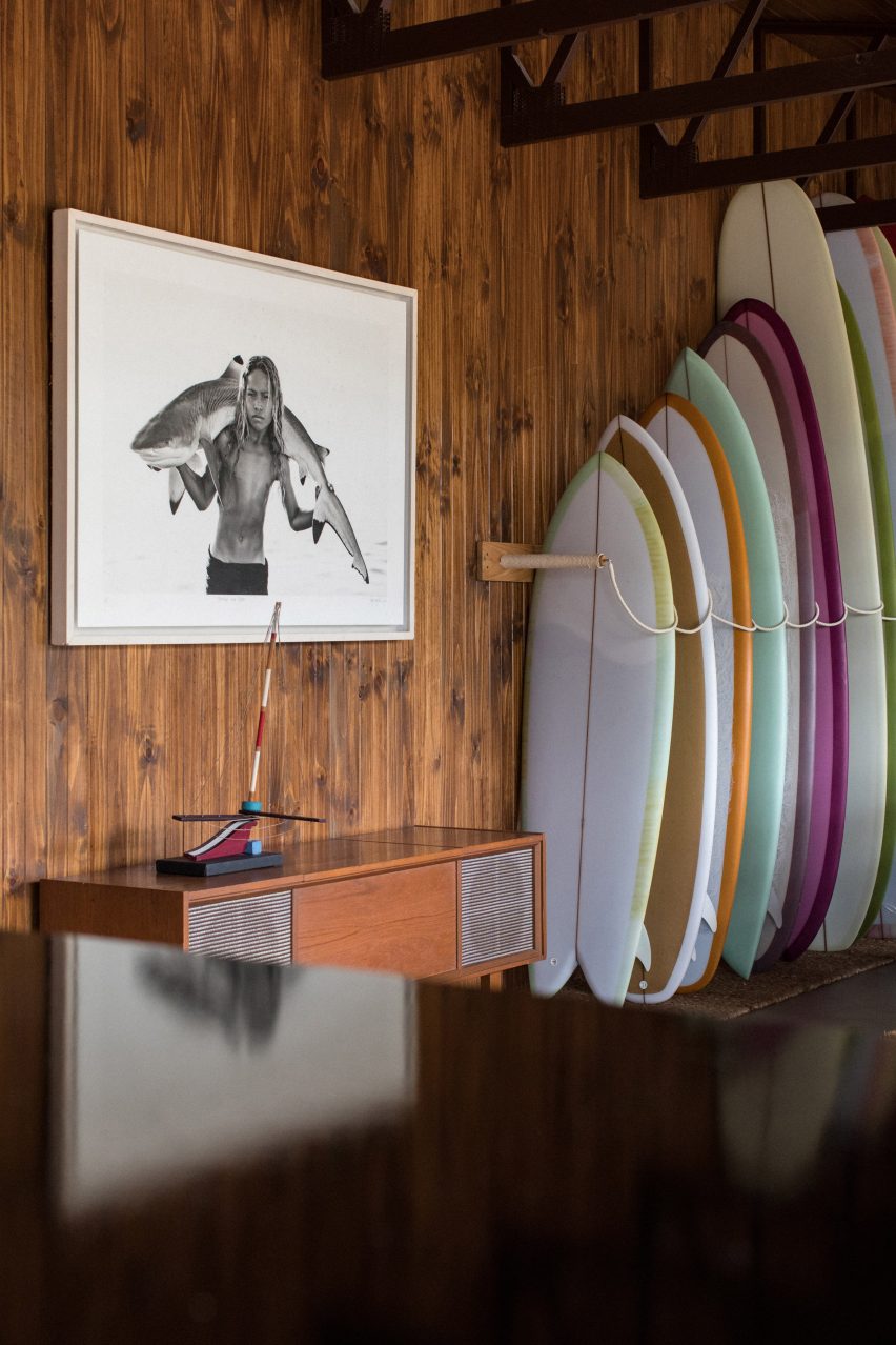 Surfboards stacked in a reception area