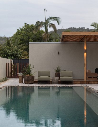 Turquoise swimming pool with seating area