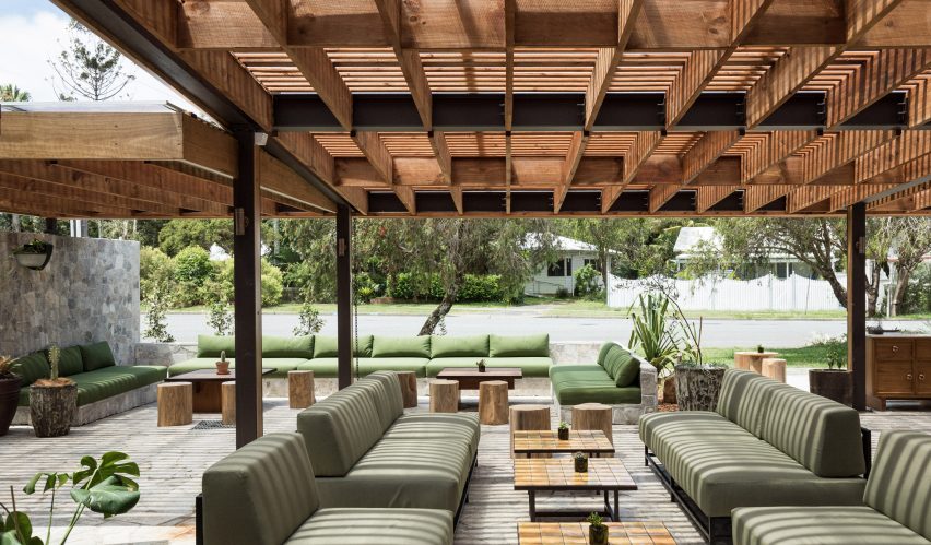 Dining are under wooden pergola facing onto street