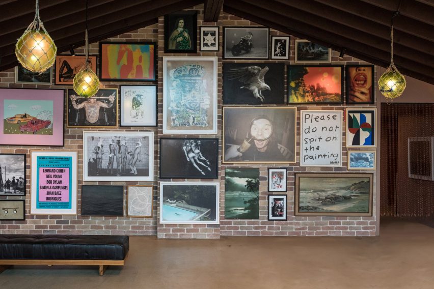 Art gallery wall with lots of hanging pictures