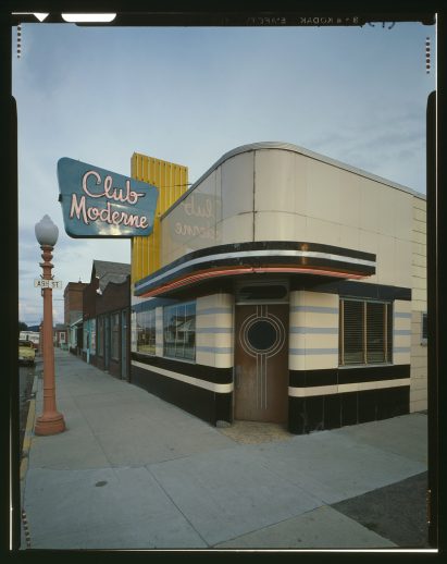 Vintage photograph of curved nightclub exterior in city street